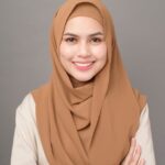 portrait of beautiful woman with hijab is smiling on gray background premium photo